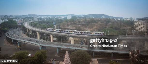 Metro rail between Vanaz to Garware college route passes from Karve road on March 6, 2022 in Pune, India. Prime Minister of India, Narendra Modi,...