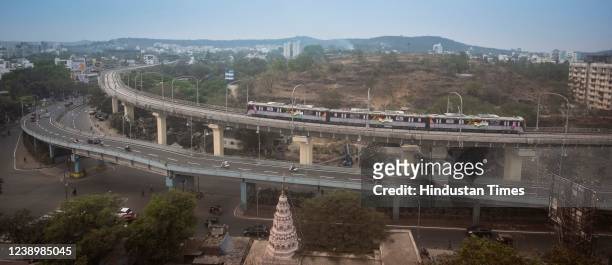 Metro rail between Vanaz to Garware college route passes from Karve road on March 6, 2022 in Pune, India. Prime Minister of India, Narendra Modi,...