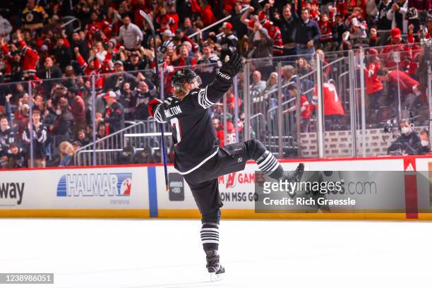 Dougie Hamilton of the New Jersey Devils celebrates to the crowd after he scores the game winning goal in overtime on March 6, 2022 at the Prudential...
