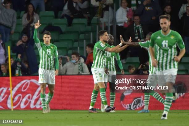 Real Betis' Spanish midfielder Cristian Tello celebrates scoring his team's first goal during the Spanish league football match between Real Betis...