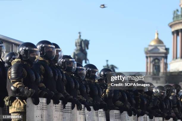 Police Officers block the street during a demonstration against the Russian military operation in Ukraine.