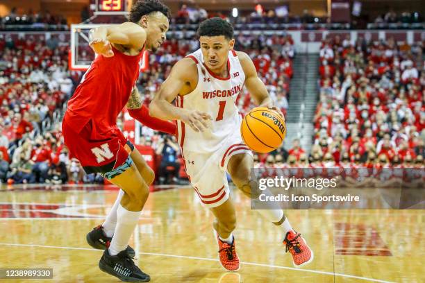 Wisconsin guard Johnny Davis tries to get around Nebraska guard Trey McGowens during a college basketball game between the University of Wisconsin...