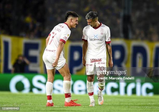 Matias Coccaro of Huracan celebrates with teammate Franco Cristaldo after scoring the first goal of his team during a match between Boca Juniors and...