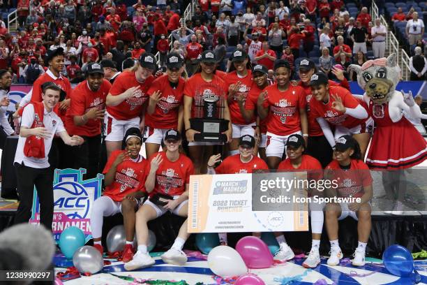 The NC State Wolfpack poses for a photo punching the ticket to the NCAA Tournament after winning the ACC Tournament championship game between the...