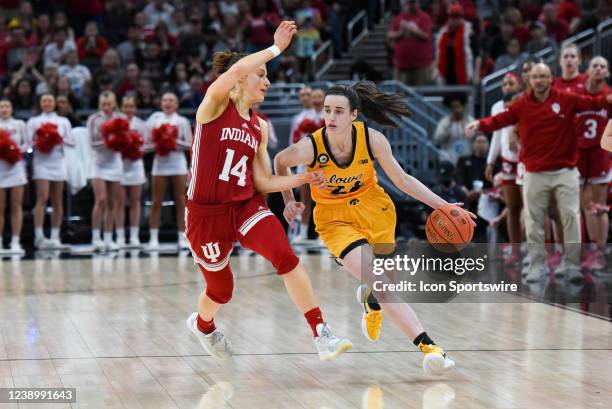 Iowa guard Caitlin Clark drives around Indiana guard Ali Patberg during the Women's Big Ten Tournament Championship college basketball game between...