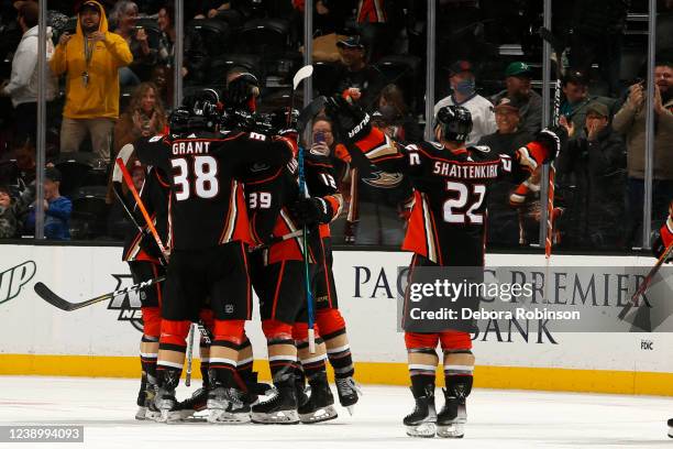 Kevin Shattenkirk and Derek Grant of the Anaheim Ducks celebrate with their teammates following a 3-2 overtime win against the San Jose Sharks at...