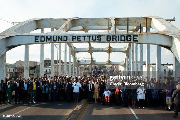 Vice President Kamala Harris, front center, other participants walk over the Edmund Pettus Bridge during an event marking the 57th anniversary of the...