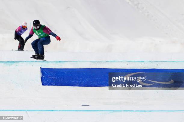 James Barnes-Miller of Team Great Britain competes during Men's Snowboard Cross SB-UL Finals at Genting Snow Park during day three of the Beijing...