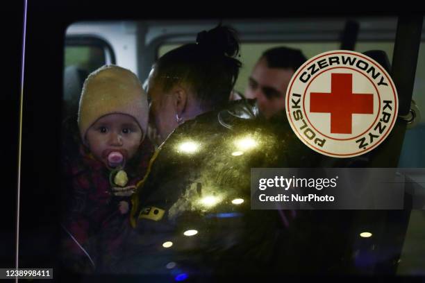 Child inside a car with Polish Red Cross sticker parked in front of the main station where those fleeing from Ukraine arriving in Przemysl, Poland on...