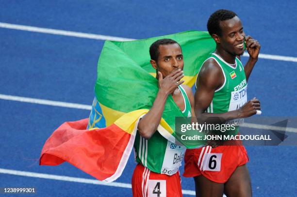 Ethiopia's Kenenisa Bekele and Ethiopia's Ali Abdosh celebrate after the men's 5000m race of the 2009 IAAF Athletics World Championships on August...