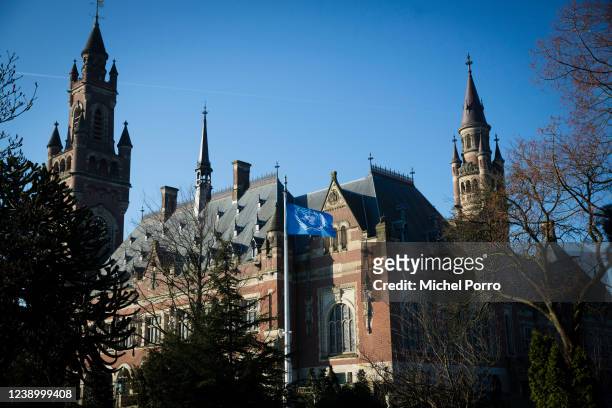 The United Nations flag waves ouside the International Court of Justice or Peace Palace on the first day of hearings between Ukrain and Russia on...