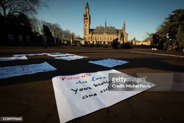 Signs with support for the Ukrainian people are laid in front of the International Court of Justice or Peace Palace on the first day of hearings on...