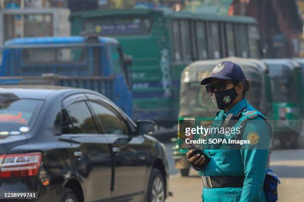 Woman police officer is on duty in Dhaka before International Women's Day on 8th March.