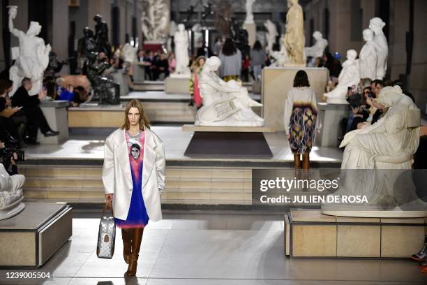 Models present a creation for the Louis Vuitton Fall-Winter 2022-2023 collection fashion show, as part of the Paris Womenswear Fashion Week at Orsay...
