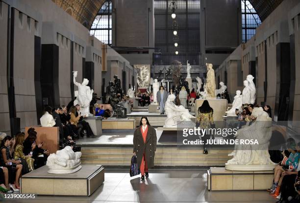 Models present a creation for the Louis Vuitton Fall-Winter 2022-2023 collection fashion show, as part of the Paris Womenswear Fashion Week at Orsay...