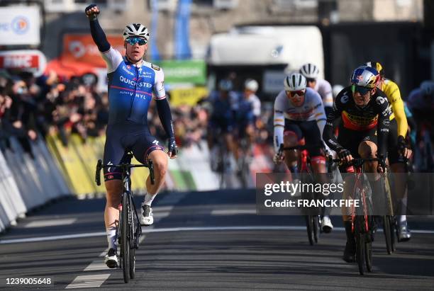 Quick-Step Alpha Vinyl Team's Dutch rider Fabio Jakobsen celebrates next to Jumbo-Visma's Belgian rider Wout Van Aert and Jumbo-Visma's French rider...