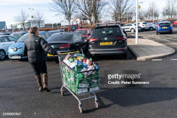 Val Reid, a volunteer with Community for Food, is seen collecting donations from Morrisons supermarket on February 25, 2022 in Edinburgh, Scotland....