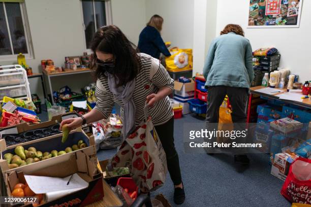 Volunteers are seen packing food parcels on March 02, 2022 in Edinburgh, Scotland. With the cost of living rocketing in the uk, annual inflation...