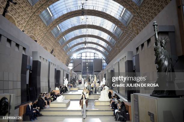 Models present a creation for the Louis Vuitton Fall-Winter 2022-2023 collection fashion show, as part of the Paris Womenswear Fashion Week at Orsay...