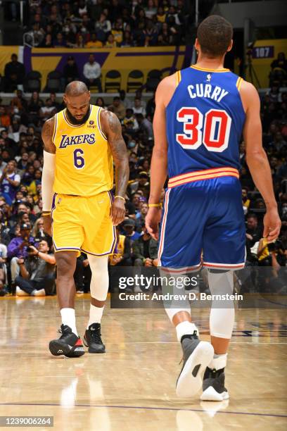 LeBron James of the Los Angeles Lakers and Stephen Curry of the Golden State Warriors look on during the game on March 5, 2022 at Crypto.Com Arena in...