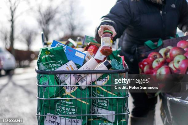 Val Reid, a volunteer with Community for Food, is seen unpacking donations from Morrisons supermarket on February 25, 2022 in Edinburgh, Scotland....