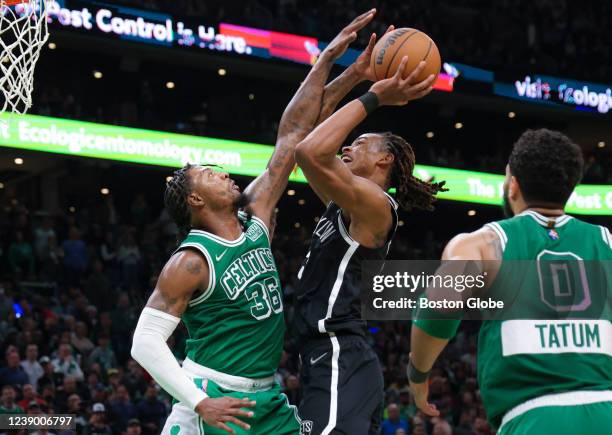 Boston Celtics guard Marcus Smart fouls Brooklyn Nets forward Nic Claxton during the fourth quarter. The Boston Celtics host the Brooklyn Nets during...