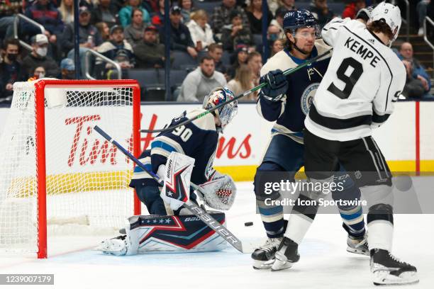 Columbus Blue Jackets defenceman Andrew Peeke and Los Angeles Kings center Adrian Kempe in front of the goal as Columbus Blue Jackets goalie Elvis...
