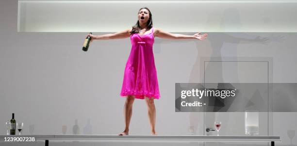 In this picture taken late on July 25, 2009 opera performer Isabel Leonard performs a scene from Mozart's Cosi Fan Tutte during the Salzburg Festival...