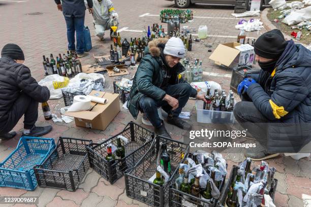 Members of the Kyiv defence battalion seen preparing Molotov Cocktails to be used to defence the capital city from the Russians.