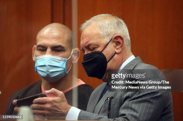 Cain Velasquez, left, is photographed with his attorney Mark Geragos, right, during a hearing at the Santa Clara County Hall of Justice on Monday,...