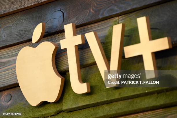 The Apple TV+ logo is seen on the backdrop for the red carpet arrivals of "The Last Days of Ptolemy Grey" premiere at the Bruin Theatre in Westwood,...