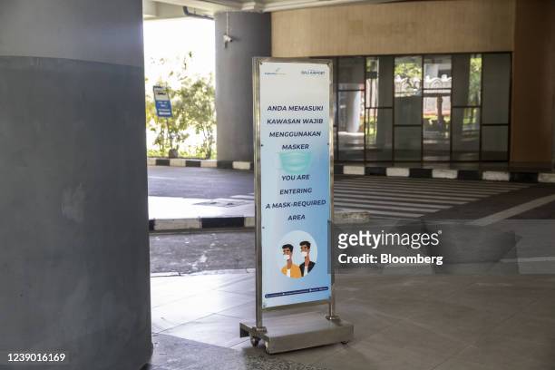 Mask required sign at Ngurah Rai International Airport in Bali, Indonesia, on Monday, March 7, 2022. Indonesia started to allow quarantine-free entry...