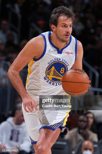 Nemanja Bjelica of the Golden State Warriors dribbles the ball during the game against the Denver Nuggets on March 7, 2022 at the Ball Arena in...
