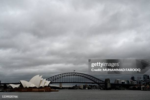 Storm clouds move over the Sydney Harbour Bridge and Opera House on March 8 amid the national weather bureau warned of "a tough 48 hours ahead" for...