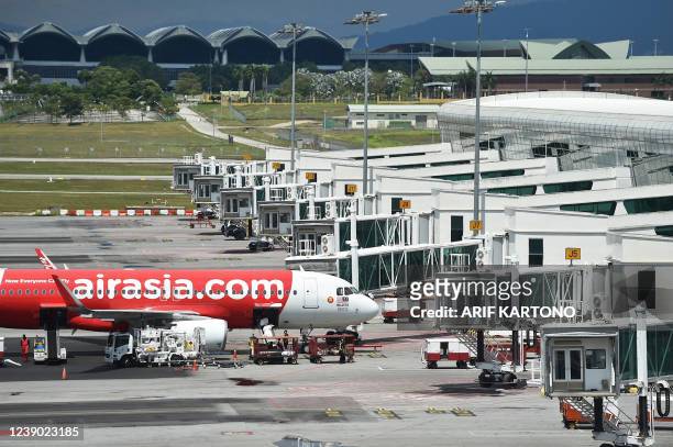 An Air Asia Airbus A320 aircraft is seen on the tarmac at the Kuala Lumpur International Airport's low-cost carrier terminal in Sepang on March 8...