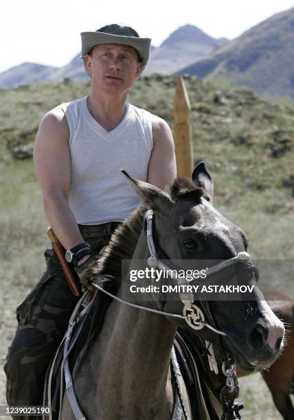 Russian President Vladimir Putin rides a horse near the foothills of the Western Sayan Mountains in the Republic of Tuva, 15 August 2007. Putin is...