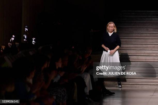 Italian designer Miuccia Prada acknowledges the audience at the end the Miu Miu Fall-Winter 2022-2023 collection fashion show during the Paris...