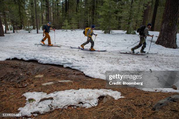 Cross country skiers on melting snow at Johnson Canyon, near Donner Summit, in Soda Springs, California, U.S., on Thursday, March 3, 2022....