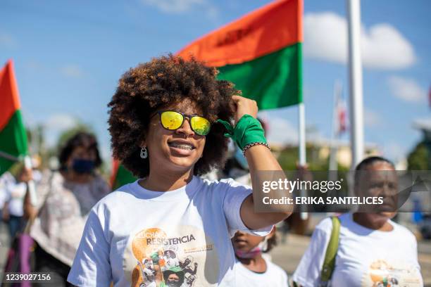 Women take part in a demonstration to demand greater rights for women in front of the National Congress in Santo Domingo, on March 8 on International...