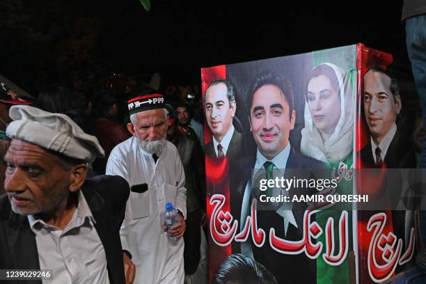 Supporters of opposition Pakistan Peoples Party gather around a truck carrying Chairman of PPP Bilawal Bhutto Zardari, leading an anti-government...