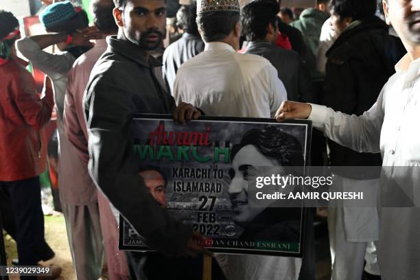 Supporters of opposition Pakistan Peoples Party gather around a truck carrying Chairman of PPP Bilawal Bhutto Zardari, leading an anti-government...