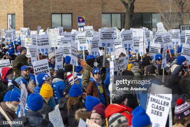 Minneapolis school teachers hold placards during the strike in front of the Justice Page Middle school in Minneapolis, Minnesota, United States on...