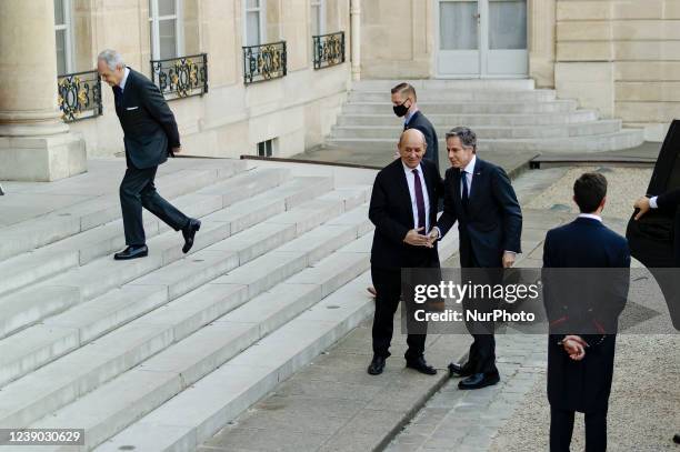 France's European and Foreign Affairs Minister Jean-Yves Le Drian welcomes US Secretary of State Antony Blinken at the Elysee palace in Paris before...