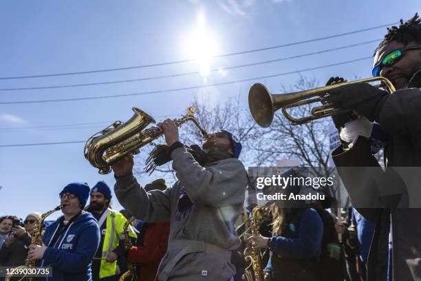 Minneapolis school teachers hold placards during the strike in front of the Justice Page Middle school in Minneapolis, Minnesota, United States on...