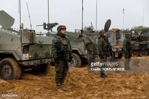 Soldiers take part in a military exercise at the Adazi military base, north east of Riga, Latvia, on March 8, 2022.