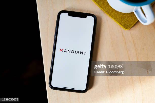 The Mandiant logo on a smartphone arranged in the Brooklyn borough of New York, U.S., on Tuesday, March 8, 2022. Google agreed to acquire...