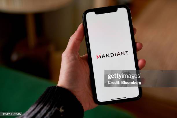 The Mandiant logo on a smartphone arranged in the Brooklyn borough of New York, U.S., on Tuesday, March 8, 2022. Google agreed to acquire...