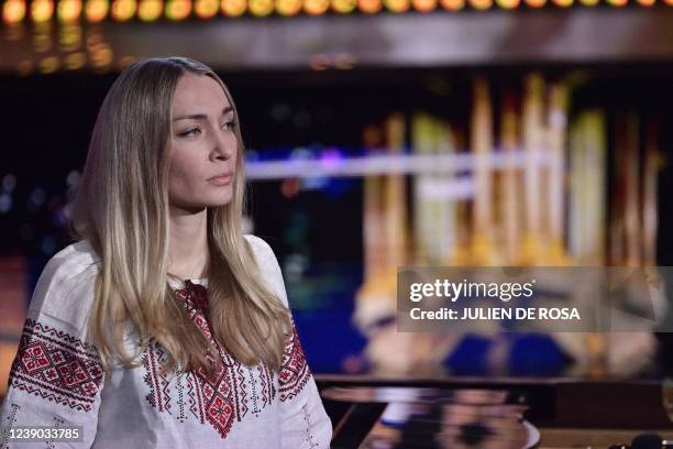 Leader of the feminist activist group Femen Ukrainian Inna Shevchenko attends in Paris on March 8 the "United for Ukraine" TV live event to support...