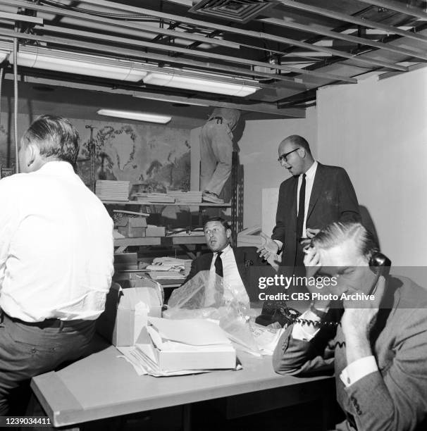 Seen here, seated in center, Don Hewitt, and standing at right, Philip Scheffler, during preparation of the new CBS News broadcasting studio at 420...