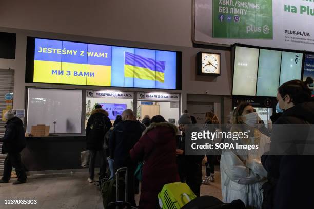 Ukrainian refugees lining up for bus tickets in Warszawa Zachodnia station to other countries for resettlement. As war crisis in Ukraine continues,...